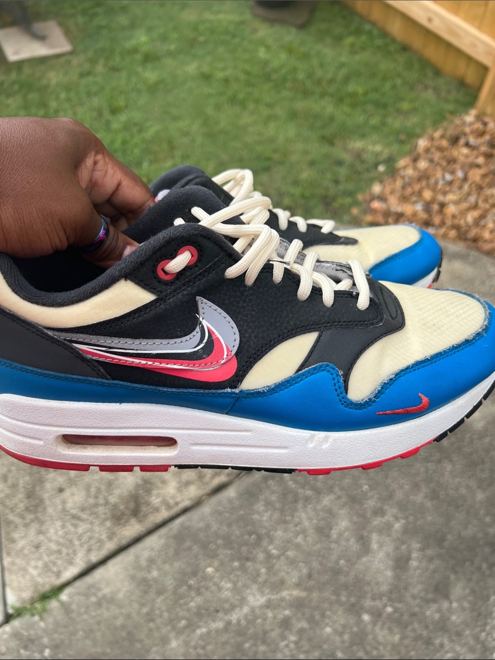Nike Air Max low-top sneakers in blue, black, cream & red accents